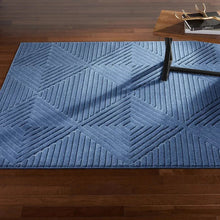 Indoor area rug, denim blue, raised chevron and diamond geometric pattern