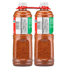 Two seasoning squeeze bottles with red flip caps and green label backs