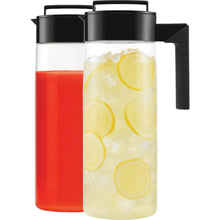 Two beverage pitchers with black handles: red drink and pale yellow citrus slices