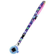 Purple character lanyard with black clips and blue soccer ball keychain