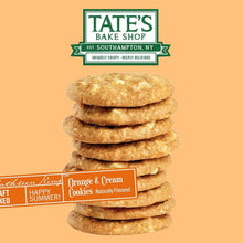Stack of thin crispy orange and cream cookies with white chocolate chips on front label