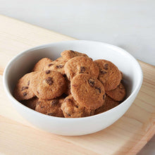 Bowl of baked cookie rounds with chocolate chips
