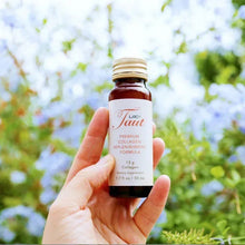 Collagen supplement bottle held in hand, amber glass with white cap and red label.