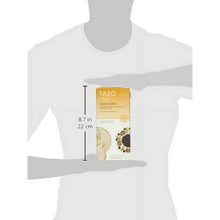 Chai latte concentrate carton held by person, about 8.7 in tall