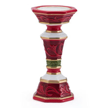 Red and gold pillar candleholder with embossed patterns on the base