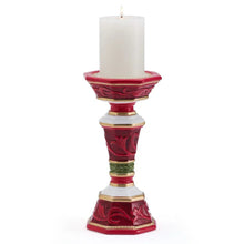 Red and gold pillar candleholder for a white pillar candle, front view