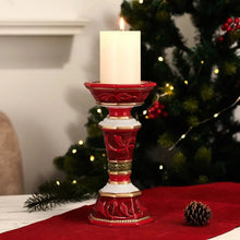 Red and gold pillar candleholder with a white pillar candle