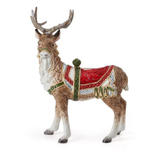 Standing deer candle holder with red saddle and lifted antlers