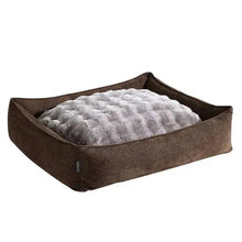 Reversible pet bed with dark brown cover and gray plush quilted inner pad