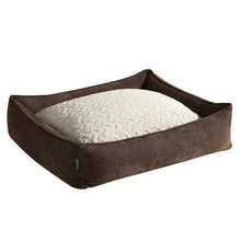 Reversible pet bed with dark brown fabric sides and white quilted inner pad
