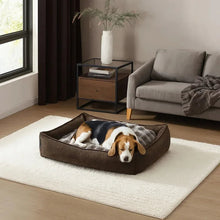 Reversible pet bed in dark brown with plush top insert; dog resting inside