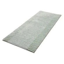 Textured stripe microfiber bath rug, angled view showing plush vertical stripe texture
