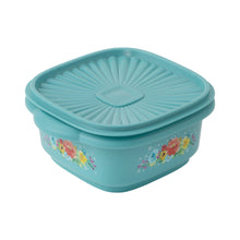 Teal plastic food storage container with lid, sunburst emboss and floral print
