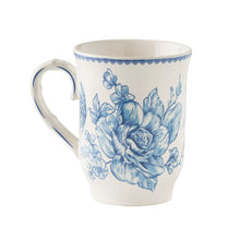 Blue floral stoneware mug with scalloped rim and curved handle