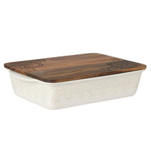 Rectangular ceramic casserole baking dish with dark wood lid and embossed linen pattern