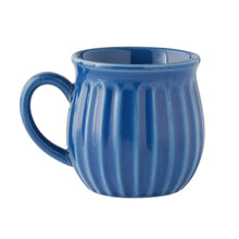 Blue stoneware mug with ridged sides and curved handle