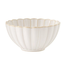 Cream ceramic cereal bowl with fluted ridges and scalloped rim