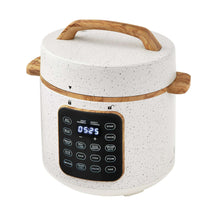 Speckled white pressure cooker with wooden handles and touch control panel display