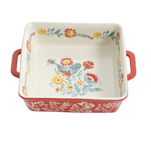 Square ceramic baking dish with red exterior handles and floral print, 8-inch size