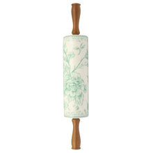 Ceramic rolling pin with wood handles and green floral design