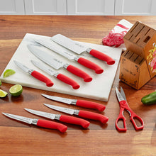 Red-handled knives and kitchen shears with matching blades and wooden block