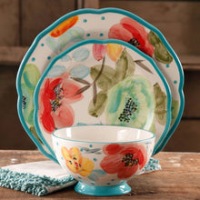 Turquoise-rim floral bowl with matching dinner plates featuring dot and blossom designs