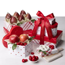 Fruit gift tower with red bow, apples and pears, plus wrapped heart-shaped treats