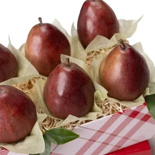 Pears in parchment cups with shredded filler and red-and-white plaid wrap