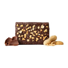 Chocolate peanut butter bar with chopped nuts and small chocolate pieces