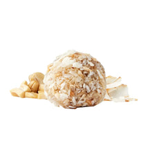 Coconut snack bite with shredded coconut flakes
