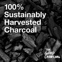 Close-up of dark lump charcoal chunks with Good Charcoal logo