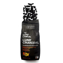 Lump charcoal bag with charcoal pieces piled on top, black premium acacia hardwood