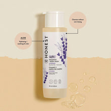 Honest lavender baby shampoo and body wash bottle with clear bubbles