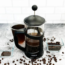 London Sip black French press brewer with coffee and glass cups