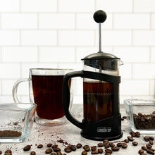 London Sip French press immersion brewer with coffee-filled chamber and plunger