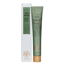 Single green calming treatment cream tube with box, wood-style cap
