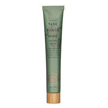 Green calming treatment cream tube with wood-style cap