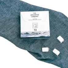 Unscented dishwasher tabs box with white tablets, 72 count, on cloth