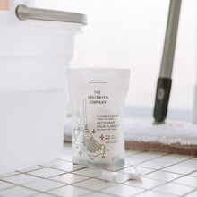 Floor cleaner tabs pouch on tile, with mop handle in background