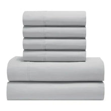 Peached percale sheet set in light gray, folded stack with elastic top sheet and flat sheets