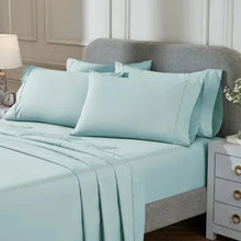 Peached percale sheet set, light blue on-bed fitted sheet and pillowcases