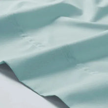 Peached percale flat sheet, light blue fabric with subtle peached texture
