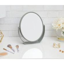 Soft-touch oval vanity mirror with gray stand