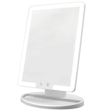 Lighted makeup mirror with angled square LED panel and round base stand
