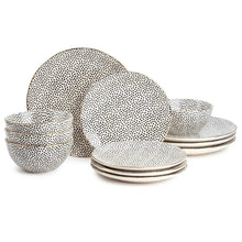 Stoneware dinnerware set with black dot medallion plates and bowls in white