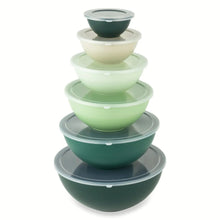 Nesting mixing bowl set with clear lids, stacked in green and pale tones