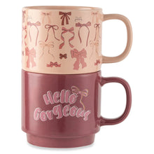 Stacking stoneware mugs with pink bow pattern and “Hello gorgeous” on the plum mug