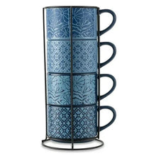 Blue floral-pattern stacking mugs on black wire rack, four mugs