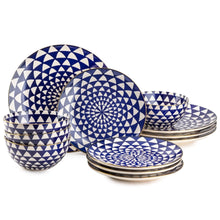 Blue ceramic dinnerware set with medallion pattern, bowls and plates