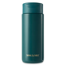 Teal stainless coffee tumbler with flip-top lid and THYME & TABLE logo